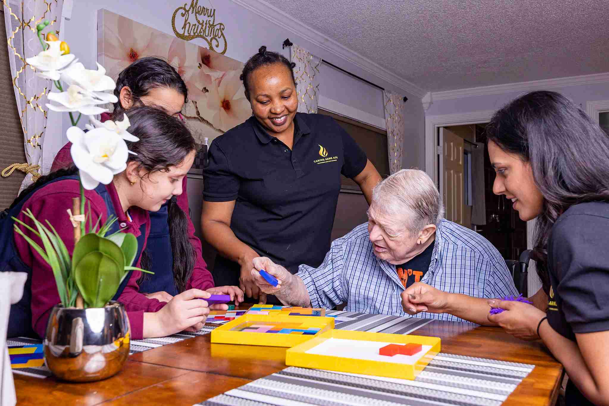 Caregivers at Des Moines Assisted Living Community providing professional care for memory loss patients and long-term illness