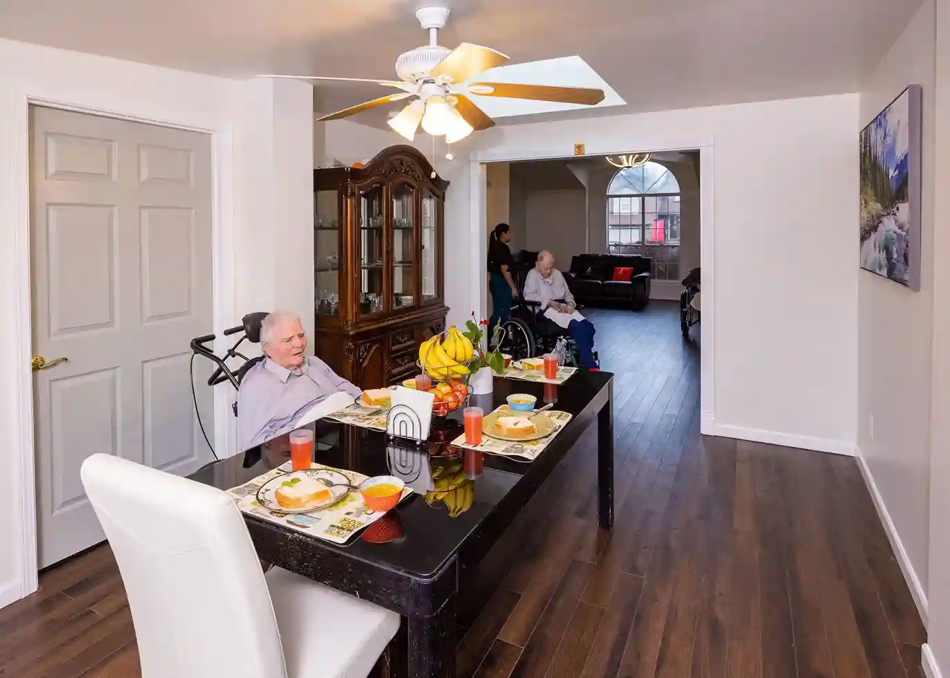 senior residents having quality food and time at Caring Arms Adult Family Homes in Kent WA