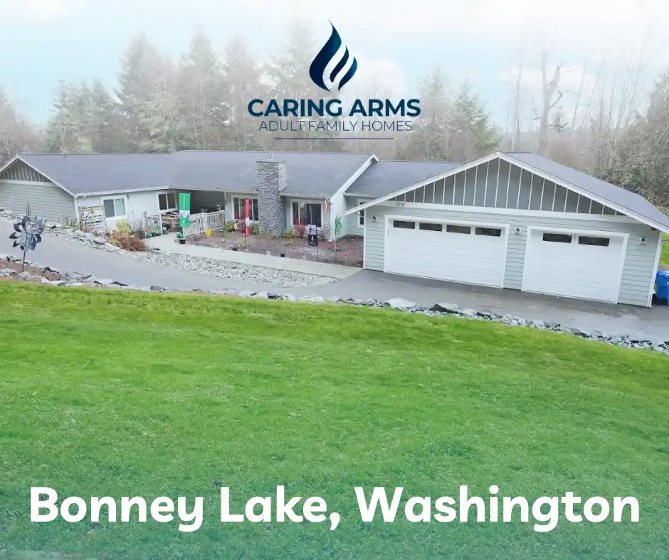 Senior resident receiving personalized care from caregiver inside a comfortable adult family home in Bonney Lake with a warm, homelike setting.