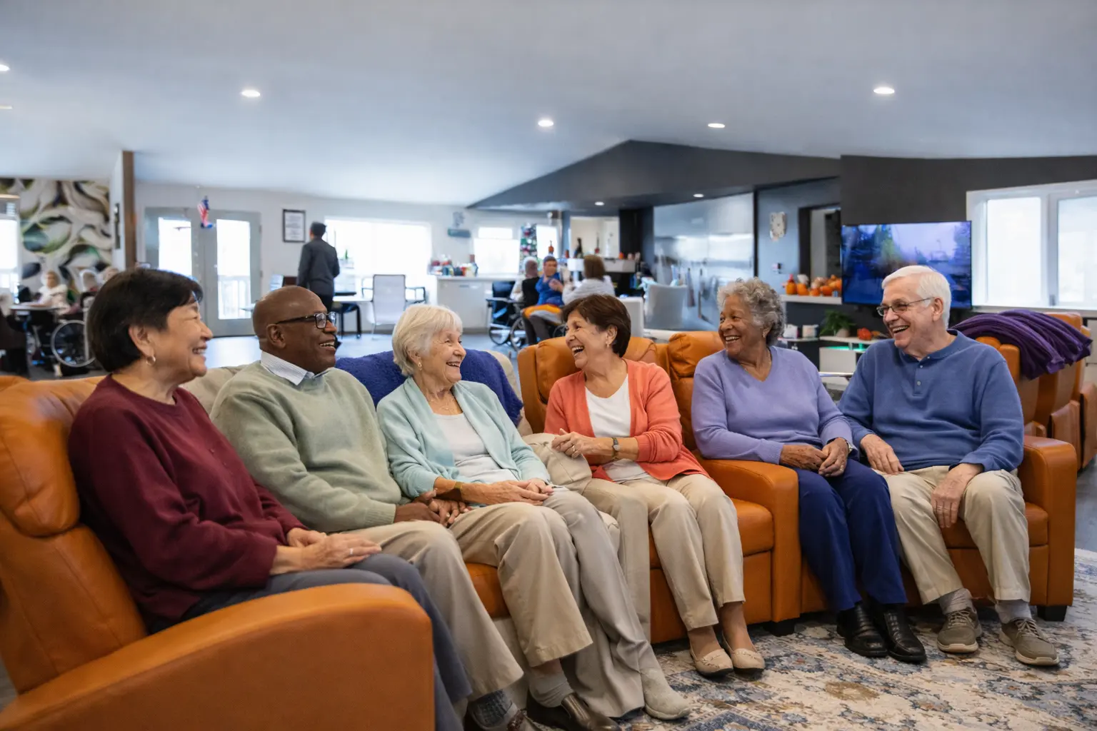 adult family home in Washington with 6 residents sitting in common area