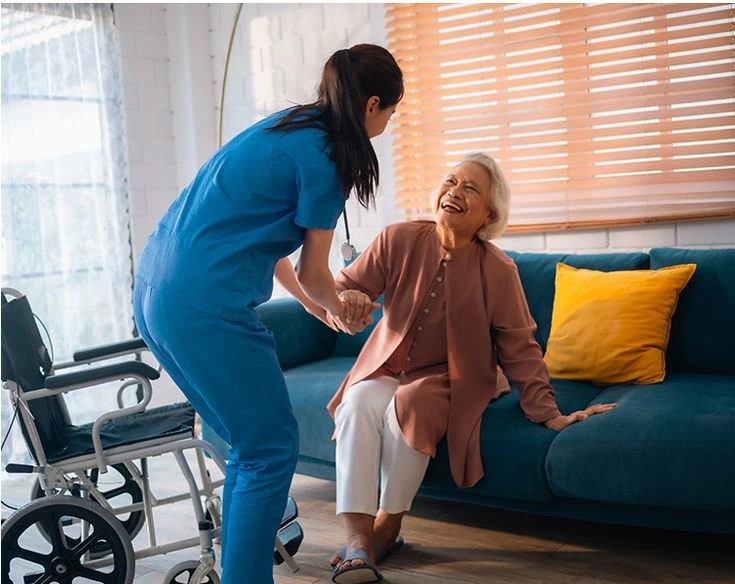 Caregiver assisting elderly resident in short-term respite care facility in Washington State