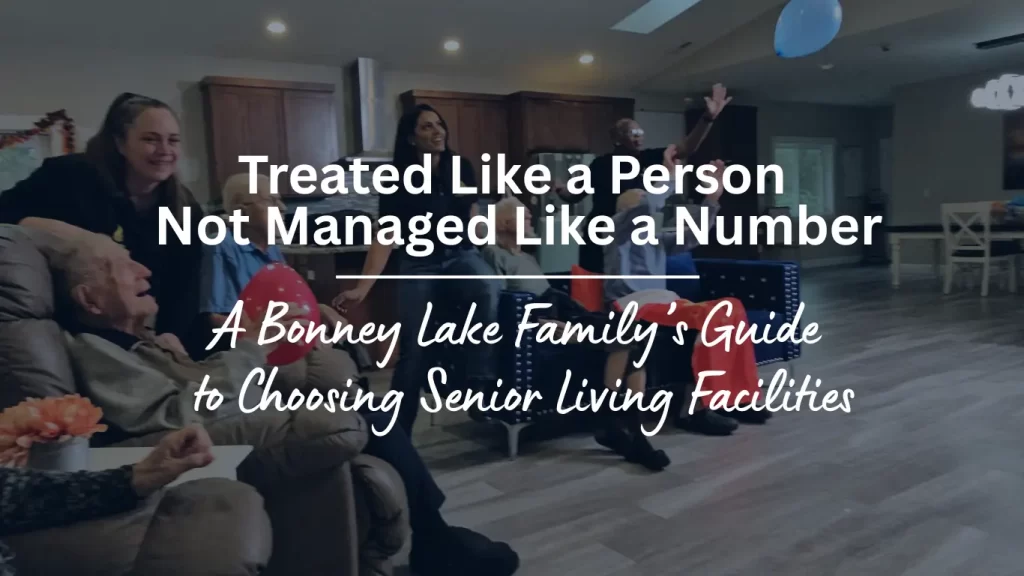 Caregiver spending quality time and participating in activities with senior resident at Caring Arms Adult Family Home in Bonney Lake Washington