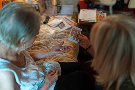 elder lady with lewy body dementia getting help from professional caregiver in a senor care facility